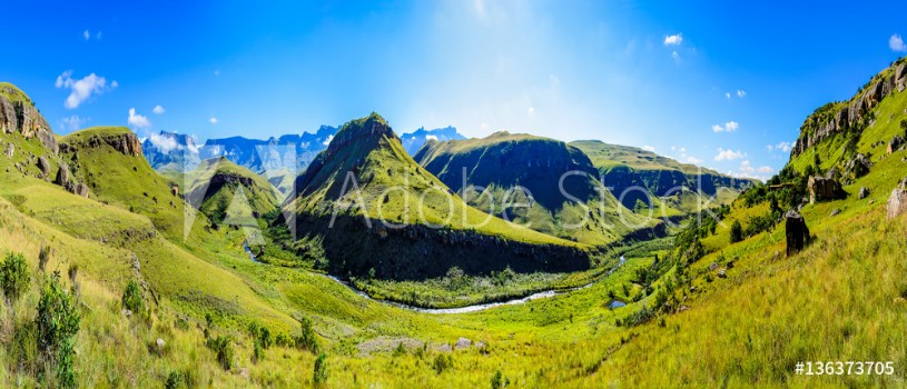 Picture of South Africa Drakensberg Giants Castle scenic panoramic impressive landscape view - green wide panorama with sunny blue sky - mountains valleycreekgrass brighthorizoncloudstravelstunning